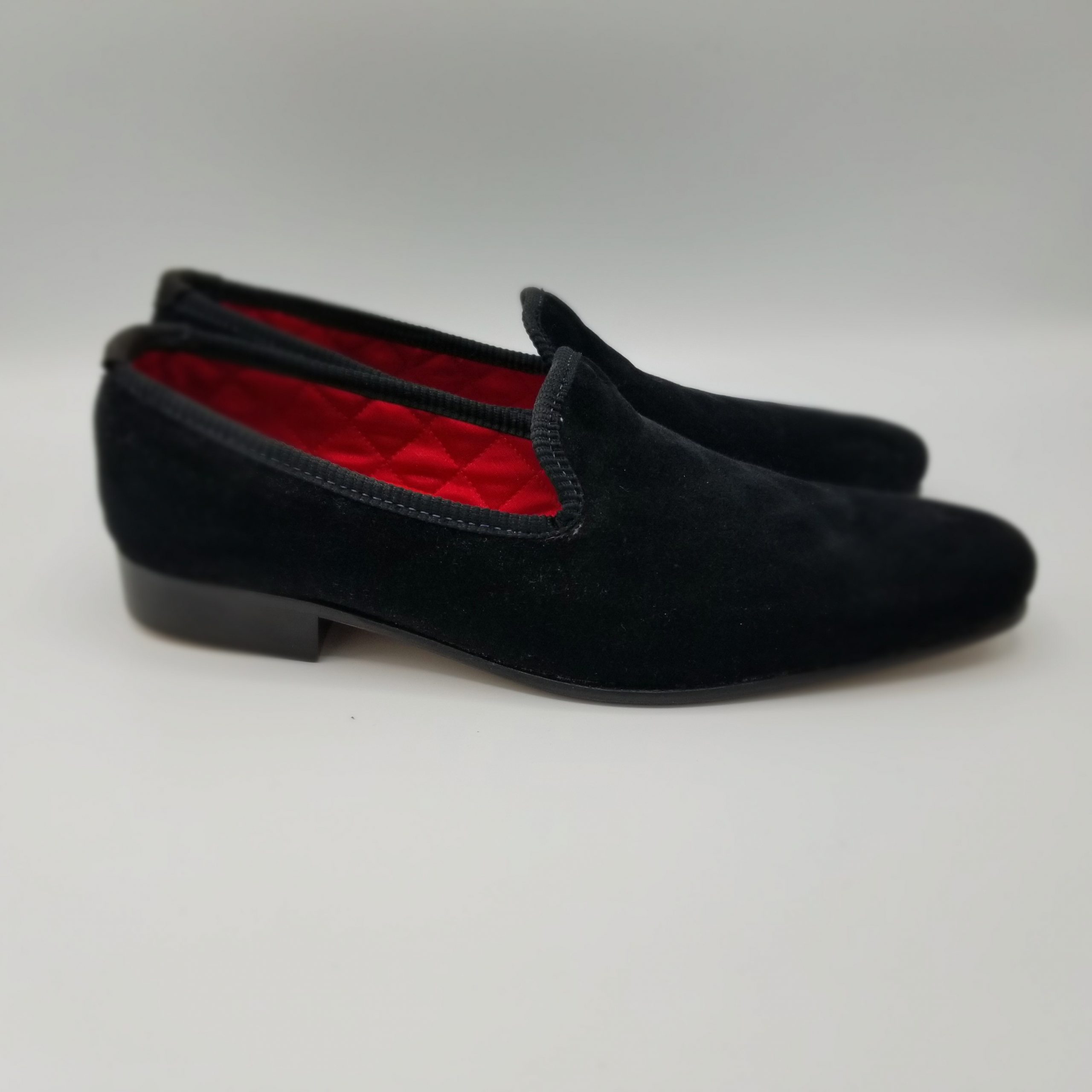 black loafers with red inner lining