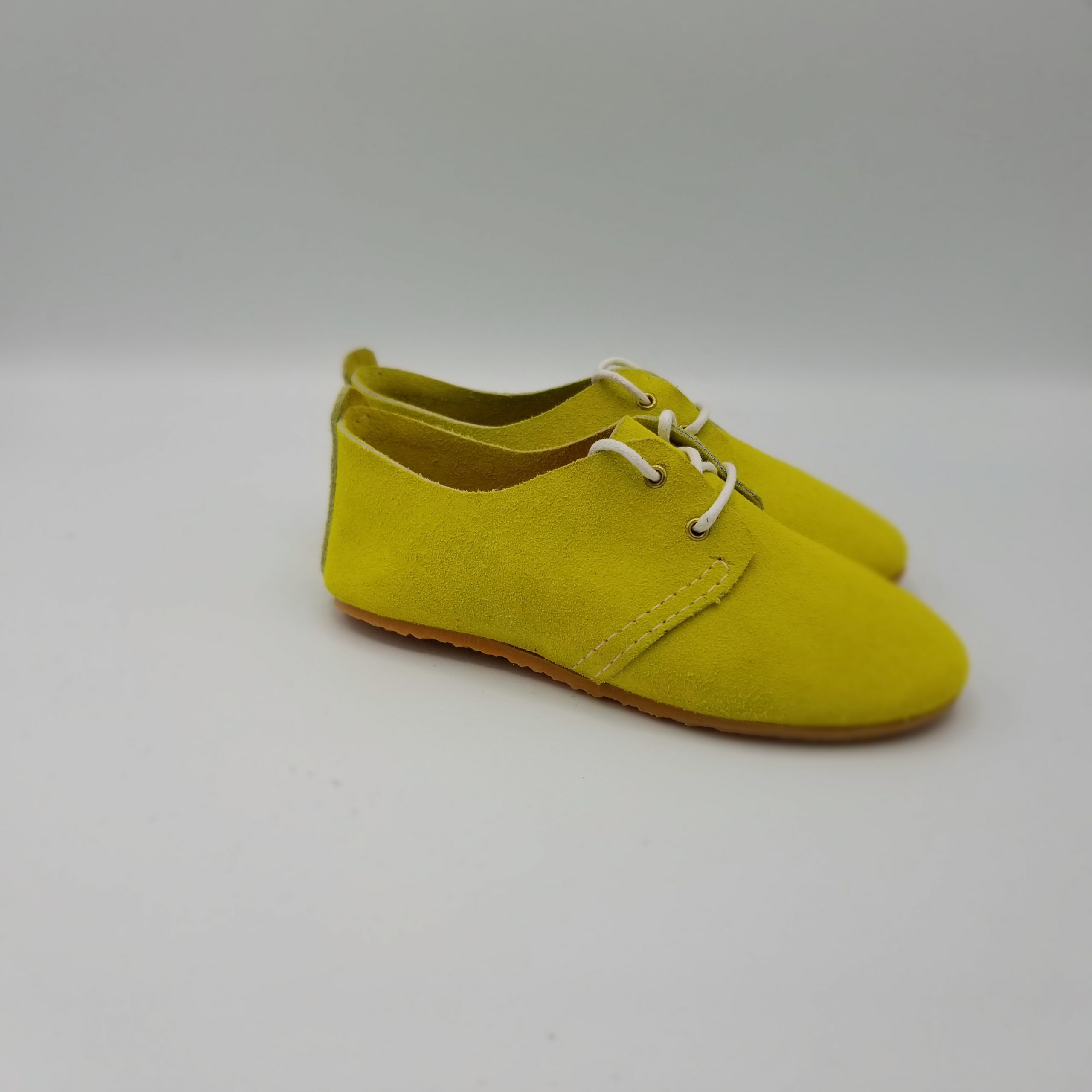 A pair of yellow shoes
